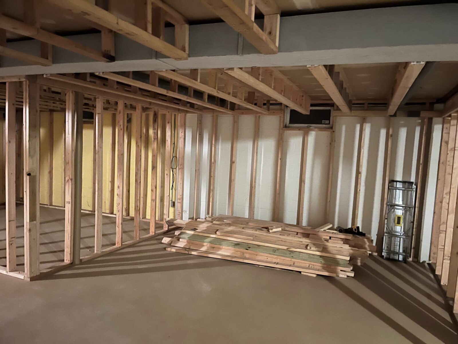New wood stud walls framed in a basement during a build-out